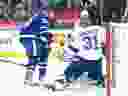 Tampa Bay Lightning goaltender Jonas Johansson makes a stop on Maple Leafs centre Auston Matthews on Monday.