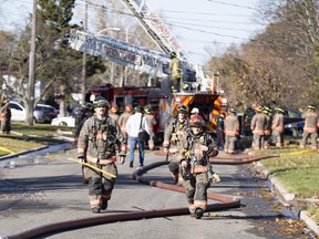 Toronto Fire crews work the scene of a house explosion.