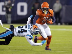 Chicago Bears running back D'Onta Foreman is tackled by Carolina Panthers linebacker Kamu Grugier-Hill during the first half of an NFL football game Thursday, Nov. 9, 2023, in Chicago.