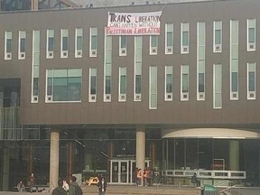 A banner hanging from the University of British Columbia student union building reads: "Trans liberation can't happen without Palestinian liberation."