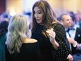 Caitlyn Jenner (R) arrives for the White House Correspondents' Association dinner