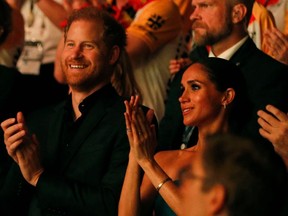 Harry, Duke of Sussex and patron of the Invictus Games (L), and his wife Meghan, Duchess of Sussex, attend the closing ceremony of the 2023 Invictus Games in Duesseldorf, western Germany on September 16, 2023.