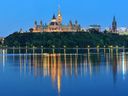 The Ottawa cityscape as seen at night.