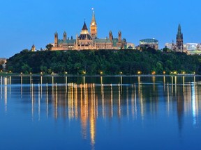 The Ottawa cityscape as seen at night.