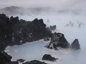 tourists relax in the Blue Lagoon