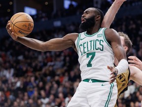Celtics' Jaylen Brown grabs a rebound against the Raptors during second half NBA In-Season Tournament action at Scotiabank Arena in Toronto, Friday, Nov. 17, 2023.