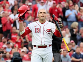 Joey Votto of the Cincinnati Reds acknowledges the crowd before his first at bat of the season in the second inning against the Colorado Rockies at Great American Ball Park on June 19, 2023 in Cincinnati, Ohio.