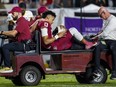 Florida State quarterback Jordan Travis is taken off the field after being injured during the first half of the team's NCAA football game against North Alabama, in Tallahassee, Fla., Saturday, Nov. 18, 2023.