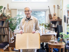 Ted Medzon holds the original score of String Quartet No. 5 written in 1935 by composer Walter Kaufmann in London on Wednesday, Nov. 1, 2023. Rediscovered by Medzon four years ago, the piece will be performed Saturday by the London Symphonia string quartet. (Derek Ruttan/The London Free Press)