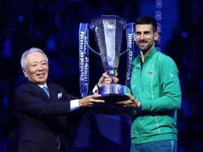 Novak Djokovic of Serbia receives the Nitto ATP Finals trophy after victory against Jannik Sinner of Italy in the Men's Singles Finals between Jannik Sinner of Italy and Novak Djokovic of Serbia on day eight of the Nitto ATP Finals at Pala Alpitour on Nov. 19, 2023 in Turin, Italy.