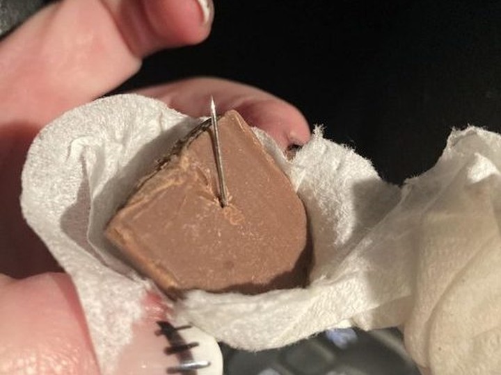  An image posted to social media of a needle found in a chocolate bar collected by a Halloween trick-or-treater in a Timmins neighbourhood on Tuesday, Oct. 31, 2023.