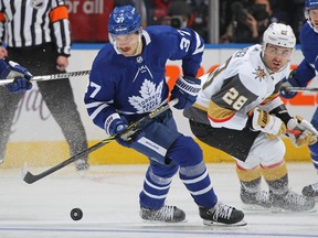 Timothy Liljegren of the Toronto Maple Leafs handles the puck against William Carrier of the Vegas Golden Knights at Scotiabank Arena on Nov. 2, 2021 in Toronto.