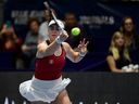 Canada's Marina Stakusic returns the ball against Italy's Martina Trevisan during the final singles tennis match between Italy and Canada on the last day of the Billie Jean King Cup Finals 2023 in La Cartuja stadium in Seville on November 12, 2023.