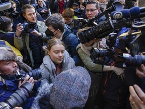 Climate activist Greta Thumberg, centre, arrives at the Westminster Magistrates Court, in London, Wednesday, Nov. 15, 2023.