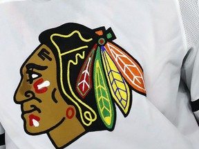 FILE - The Chicago Blackhawks logo adorns a jersey in Raleigh, N.C., May 3, 2021. A former hockey player in the Blackhawks organization has alleged in a lawsuit the team's former video coach sexually assaulted him during the 2009-10 season and the Blackhawks responded inadequately to his complaint because it did not want a disruption during its Stanley Cup run.