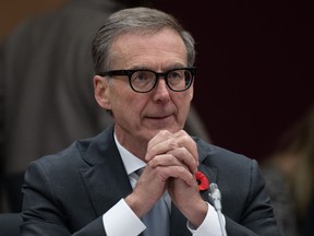 Bank of Canada Governor Tiff Macklem reads his notes as he waits to appear at the Senate Committee on Banking, Commerce and the Economy, in Ottawa, Wednesday, Nov. 1, 2023.
