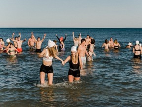 People taking part in icy plunge in Lake Ontario.