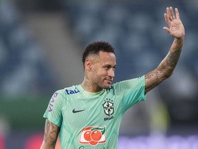 Brazil's Neymar waves to fans.