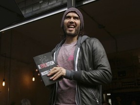 Russell Brand speaks at the opening of The Trew Era Cafe, a social enterprise community project on the New Era estate in east London, Thursday, March 26, 2015.