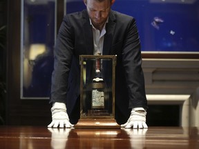 FILE - A view of a bottle of Macallan Adami 1926 whisky, on display during a media preview at Sotheby's auction house, in London, Thursday, Oct. 19, 2023. A bottle of Scotch whisky billed as "the most sought-after" in the world sold on Saturday, Nov. 18, 2023 for almost 2.2 million pounds ($2.7 million), an auction record for a bottle of wine or spirits. The Macallan Adami 1926 sold at Sotheby's in London, after a bidding war between would-be buyers on the phone and in the room.