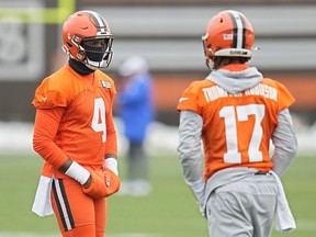 Cleveland Browns quarterback Deshaun Watson (4) walks with quarterback Dorian Thompson-Robinson (17) during an NFL football practice, Thursday, Nov. 2, 2023, in Berea, Ohio. Watson practiced for the second straight day and signs point to him starting on Sunday against Arizona after missing most of the past month with a right shoulder injury.