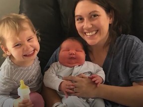 Cambridge mom Britteney Ayres poses with her fifth child, Sonny, alongside daughter Marigold.