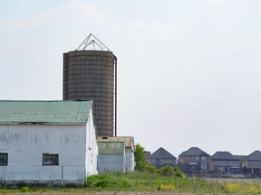 Conservative Leader Pierre Poilievre wants MPs to order the "unelected" Senate to pass a Conservative bill to take the carbon price off natural gas and propane used on farms. Houses back onto a farmer's field in Binbrook, near Hamilton, Ont., an area within the Ontario Greenbelt, Wednesday, June 7, 2023.