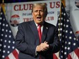 FILE - Republican presidential candidate former President Donald Trump gestures after speaking Oct. 11, 2023, at Palm Beach County Convention Center in West Palm Beach, Fla.