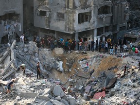 Palestinians check the destruction