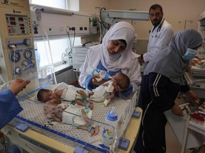 Palestinian medics care for premature babies evacuated from Al Shifa hospital to the Emirates hospital in Rafah in the southern Gaza Strip, on Nov. 19, 2023, amid ongoing battles between Israel and the militant group Hamas.