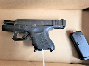 A man, 25, and a woman, 29, face charges after a vehicle stop in Markham allegedly led to the seizure of this loaded Glock .40 calibre handgun and a quantity of drugs on Monday, Nov. 20, 2023.