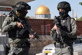 Israeli security forces block a street