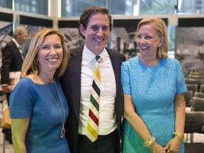 Liz Rodbell, left poses for a photo next to then-Hudson's Bay CEO Richard Baker, centre, and then-vice-chairman Bonnie Brooks after the company's AGM in Toronto on Wednesday June 19, 2013.