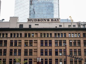 The company that owns Hudson's Bay says it completed real estate transactions in Canada and the U.S. resulting in a gain of around US$340 million. Hudson's Bay signage is pictured in the financial district in Toronto, Friday, Sept. 8, 2023.