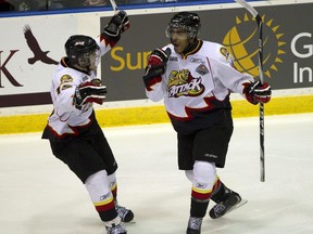 Owen Sound Attack player Matt Petgrave (right) celebrates his goal with teammate Andrew Shaw after scoring on the Saint John Sea Dogs during first period Memorial Cup action in Mississauga, Ont. on Monday, May 23, 2011.