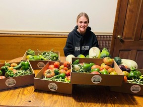 Lauren Schroeder with some of the produce she grew to donate to families in need in eastern Iowa. MUST CREDIT: Katie Schroeder