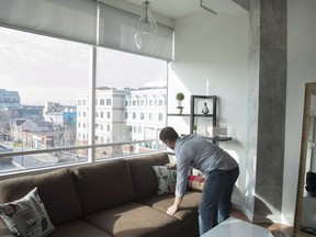 Kevin Makra is pictured preparing for guests in his Toronto Airbnb