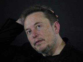 Elon Musk reacts during an in-conversation event with Britain's Prime Minister Rishi Sunak in London, Thursday, Nov. 2, 2023.