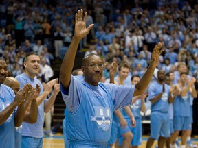 Former North Carolina Tar Heel Walter Davis acknowledges the crowd as he is introduced during the Celebration of a Century Friday, Feb. 12, 2010, at the Smith Center in Chapel Hill, N.C. Davis, a five-time NBA All-Star who had his number retired by the Phoenix Suns, has died. He was 69. Davis was star in college for North Carolina where he played for the late Dean Smith. The school's release said Walter Davis died Thursday morning, Nov. 2, 2023, of natural causes while visiting family in Charlotte, North Carolina.