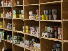 Canned products sit on shelves at the Kanata Food Cupboard, Friday, Oct. 7, 2022 in Ottawa.