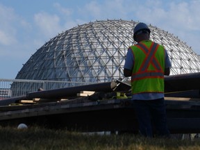 A construction worker is seen at Ontario Place in Toronto, Wednesday, Oct. 4, 2023.