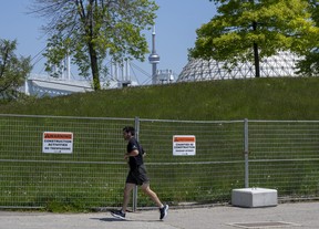 A runner turns around a closed pathway at Ontario Place in Toronto on Monday May 29, 2023.