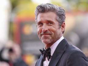 Patrick Dempsey poses for photographers upon arrival for the premiere of the film "Ferrari" during the 80th edition of the Venice Film Festival, Aug. 31, 2023, in Venice, Italy.