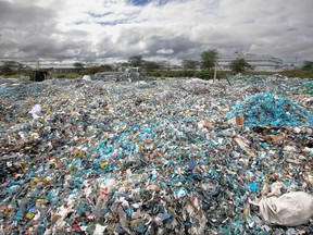A mound of plastic waste scavenged from various environments including river channels and dump sites sit in the yard at T3 (EPZ) Limited, a recycling and repurposing factory in Athi River town, Machakos county on Nov. 13, 2023.
