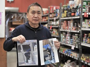 David Lee Kwen at his East West Market holding security camera images of suspected shoplifters he previously displayed at the front of the store