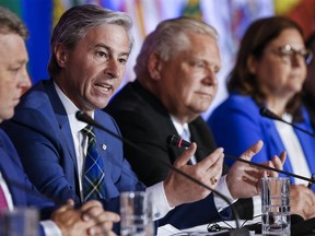 Nova Scotia Prermier Tim Houston speaks to media during the closing news conference at the Council of the Federation Canadian premiers meeting in Winnipeg, Wednesday, July 12, 2023.