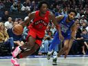 O.G. Anunoby of the Raptors drives the ball past Derrick Jones Jr. of the Dallas Mavericks at American Airlines Center on Nov. 8, 2023, in Dallas.