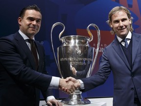 FILE - Marc Overmars, left, Director of Football of AFC Ajax, shakes hands with Pavel Nedved, Vice President of Juventus FC, at the UEFA headquarters in Nyon, Switzerland, Friday, March 15, 2019. Former Dutch soccer great Marc Overmars has been suspended one year from working in soccer in the Netherlands after admitting to sending inappropriate messages to female colleagues, it was announced Thursday, Nov. 16, 2023. Overmars relinquished his sports director role at Ajax last year and apologized for his behavior because of the scandal.