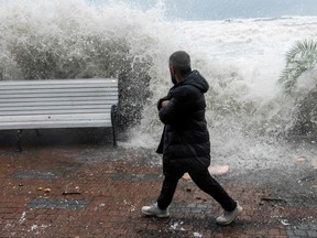 Waves crash against a seafront in the Black Sea resort city of Sochi during a storm on Nov. 27, 2023.