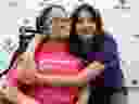 A sisterly hug: Variety Village ambassadors, Maya Salas Martinez ,11, (in purple), with her sister Amanda Salas Martinez, 16, (in pink), are pictured on Nov. 17, 2023. (Jack Boland, Toronto Sun) 